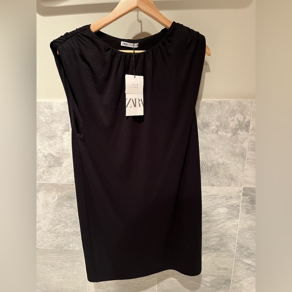 Black sleeveless mini dress